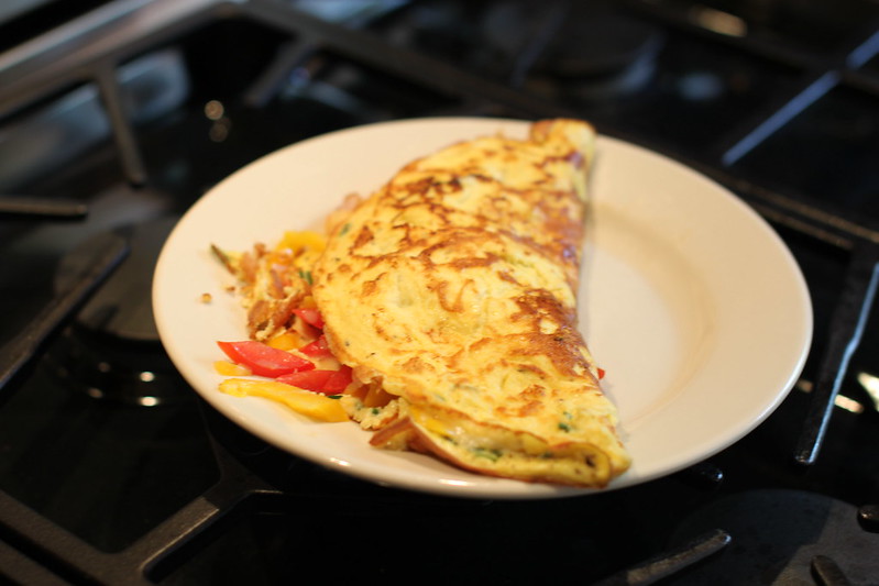 Omelet on a plate over the stovetop