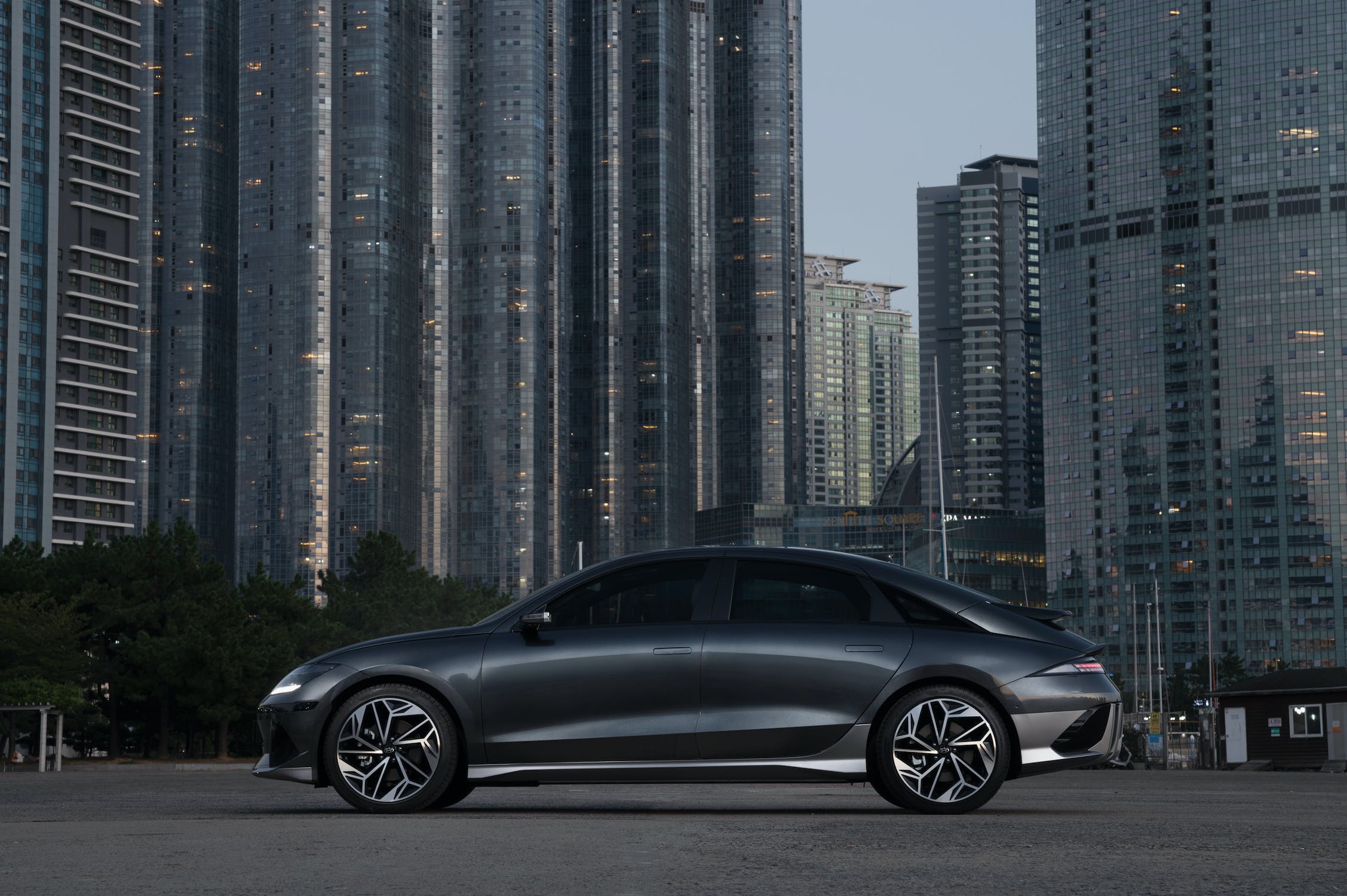 Black IONIQ EV parked in front of a city skyline