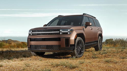2024 Hyundai Santa Fe in brown paint off-roading in the desert.