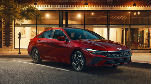 2024 Hyundai Elantra in red paint parked outside at night in Dublin, CA.