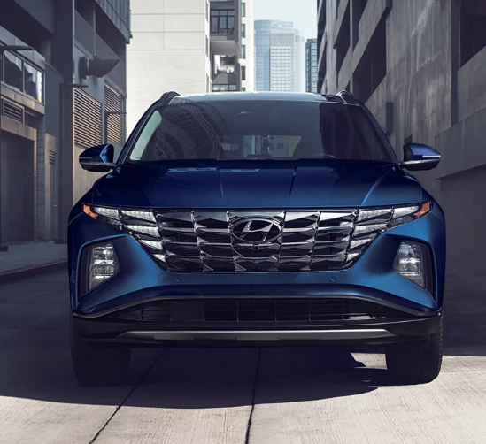 2024 blue painted 2024 Hyundai Tucson driving in Dublin, CA