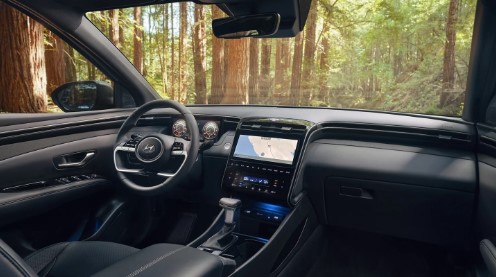 2024 Hyundai Santa Cruz interior features with black leather seating and dashboard.