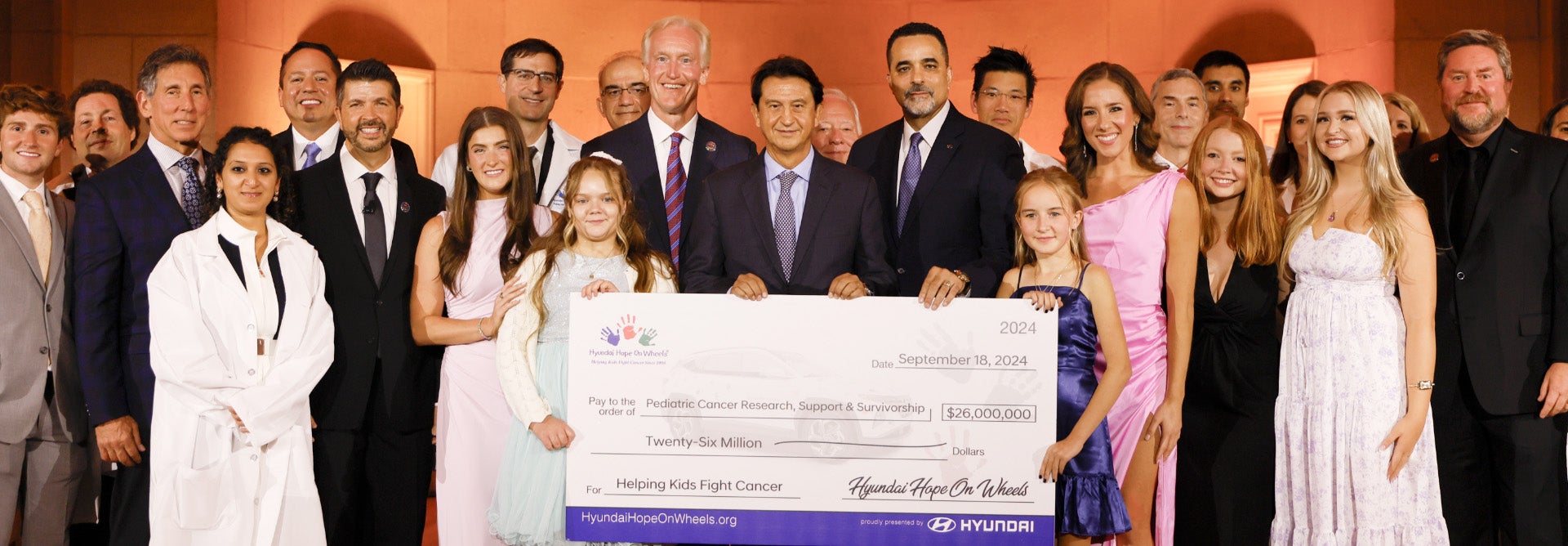 helping kids fight cancer foundation showing their big check from hyundai hope on wheels - Dublin Hyundai in Dublin CA